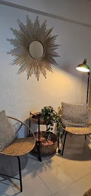 a room with two chairs and a table and a mirror at Casa dos Sinos Beach Apartment 1 with Roof Terrace in Albufeira