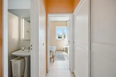 a bathroom with a sink and a mirror at Stork nest in Vilamoura