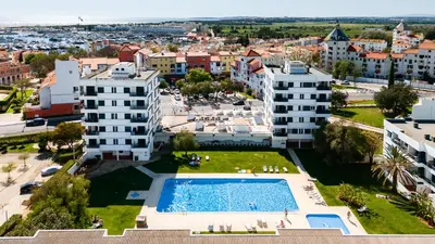 an aerial view of a city with a swimming pool at Stork nest in Vilamoura