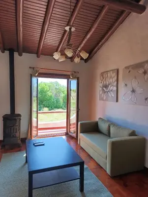 a living room with a couch and a table at Villa Inês in Guia