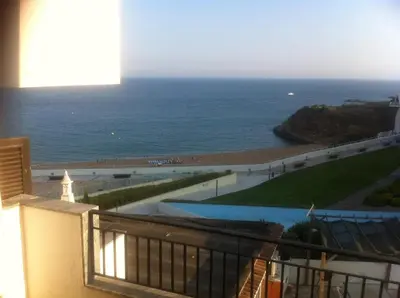 a view of the ocean from a balcony at T0 close to the beach and the city center in Albufeira