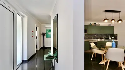 a kitchen and dining room with a table and chairs at Monte Verde A,Lar Linda - CD 293 Cleverdetails, Sleeps 2 adults and 2 children, 4 salted water pools in Quarteira