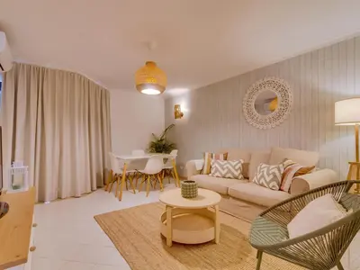 a living room with a couch and a table at AL Vilamoura Porto Marina in Vilamoura