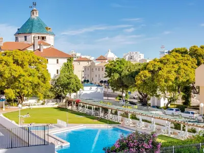 a view of a park with a pool and buildings at AL Vilamoura Porto Marina in Vilamoura