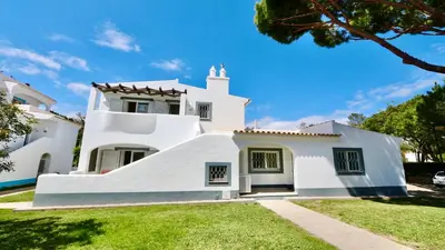 a white house with a steep slope at Monte Verde C - CD 295, Cleverdetails, Sleeps 2 adults and 2 children, 4 salted water pools in Vilamoura