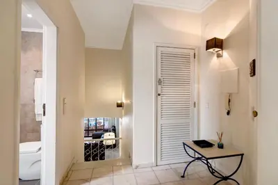 a bathroom with a toilet and a table in a room at Apartamento Tennis View in Almancil