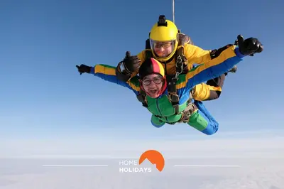 two men are flying in the air at #312 Ocean Outlook by Home Holidays in Páteo