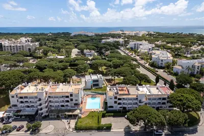 an aerial view of a city with buildings and the ocean at Apartamento Pine by Algarve Holidays in Roja- Pé