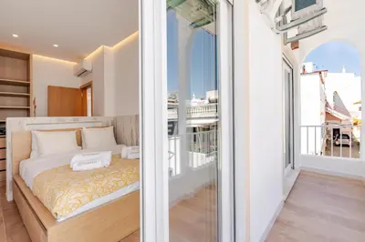 a bedroom with a bed and a balcony at Sandora Dune by Seareen in Albufeira