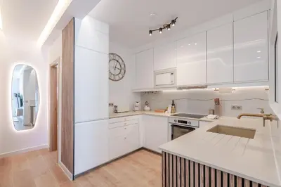 a bedroom with a large bed with white sheets at Sandora Dune by Seareen in Albufeira