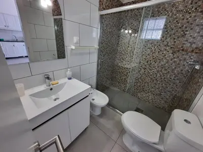 a bathroom with a sink and a toilet and a shower at Blife Montya private rooms in Faro