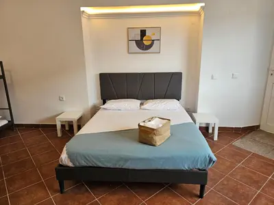 a bedroom with a bed with a box on it at Blife Montya private rooms in Faro