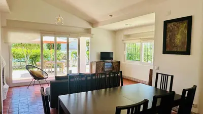 a dining room with a table and chairs at Strip II by Check-in Portugal in Albufeira