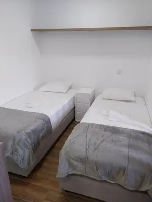 two beds sitting next to each other in a bedroom at Albufeira Oura Apartment II in Albufeira