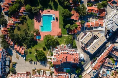 an aerial view of a house with a swimming pool at Albufeira Oura Apartment II in Albufeira
