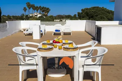 a white table with a bowl of fruit on it at #315 Apartamento Turistico by Home Holidays in Atalaia