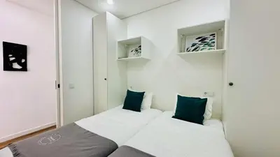 a small bedroom with a bed and two pillows at Pescadores by Check-in Portugal in Albufeira