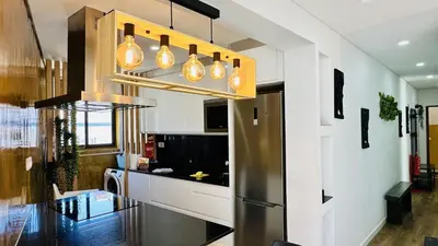 a kitchen with a stainless steel refrigerator at Pescadores by Check-in Portugal in Albufeira