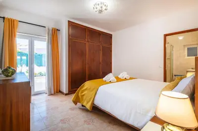 a hallway leading to a bedroom with a bed at Solar do Castelo Villa with Pool in Albufeira