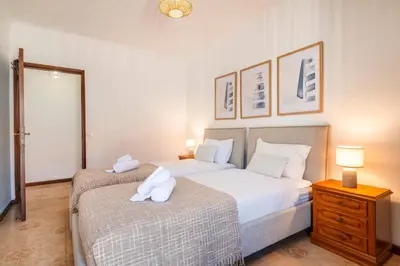 a kitchen and dining room with a table and chairs at Solar do Castelo Villa with Pool in Albufeira