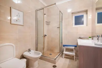 a bedroom with two beds and a window at Solar do Castelo Villa with Pool in Albufeira