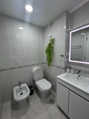 a bathroom with a toilet and a sink at Penha House II in Faro