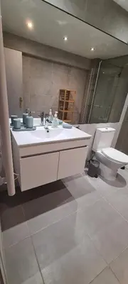 a bathroom with a sink and a toilet at Porto Marina Vilamoura LG Studio in Quarteira