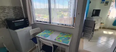 a small room with a table and a window at Porto Marina Vilamoura LG Studio in Quarteira