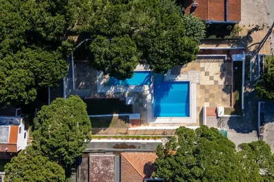 an overhead view of a house with a swimming pool at Charming Yellow Studio in Albufeira in Olhos de Água