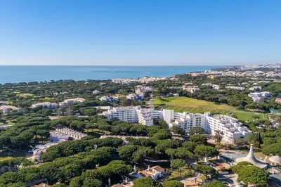 an aerial view of the city and the ocean at Charming Yellow Studio in Albufeira in Olhos de Água