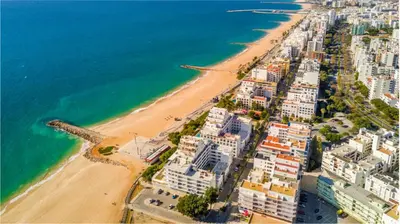 an aerial view of a beach and the ocean at 2 Bedroom by Quarteira Beach in Quarteira