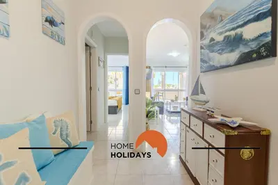 a hallway with a living room with a couch and a table at #283 Palmeira Gale by Home Holidays in Galé