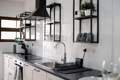 a kitchen with a sink and aaucet at Apartamento JADA in Albufeira