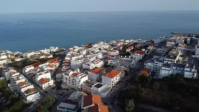 an aerial view of a city next to the ocean at Apartamento JADA in Albufeira
