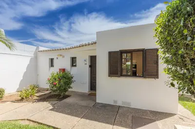 a white house with a window at Albufeira Club 109 in Albufeira
