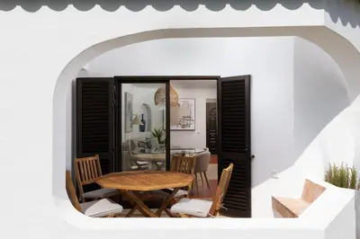 a dining room with a table and chairs at Albufeira Club 109 in Albufeira