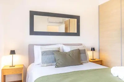 a living room with a sliding glass door at Casa Milea - Vilamoura Marina in Vilamoura
