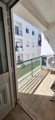 a balcony with a view of a building at Manu's Place in Albufeira