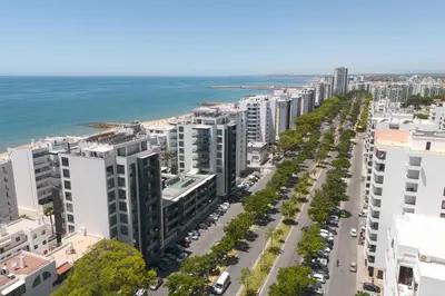 an aerial view of a city street and the ocean at Terracos de Quarteira I Aqua by Real Properties in Quarteira