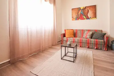 a living room with a couch and a table at Casa Bacalhau - Tunes - Jacuzzi - BY BEDZY in Tunes