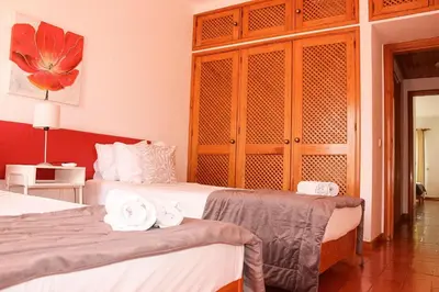 a bedroom with two beds with towels on them at Alta Oura 2 in Albufeira