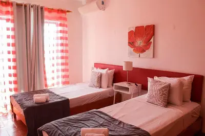 a bedroom with two beds and a window at Alta Oura 2 in Albufeira