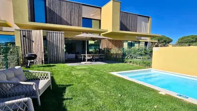 a house with a backyard with a swimming pool at Villa Rimah, Sunny Algarve, Entire Home 