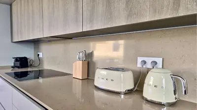a kitchen counter with a toaster on a counter top at Villa Rimah, Sunny Algarve, Entire Home 