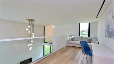 a living room with a couch and a blue chair at Villa Rimah, Sunny Algarve, Entire Home 