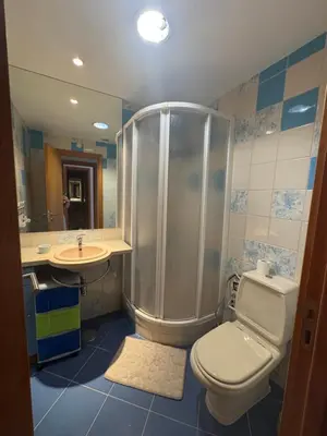 a bathroom with a shower and a toilet and a sink at Marina Albufeira Best Apartment in Albufeira