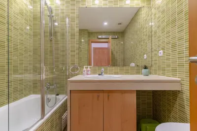 a bathroom with a sink and a tub and a shower at #327 Corcovada 43 Vista Piscina by Home Holidays in Albufeira