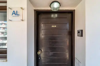 a black door with a light on top of it at Albufeira Algarve - 302 by HelloVacations in Albufeira