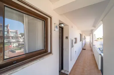 a hallway with a large window in a house at Albufeira Algarve - 302 by HelloVacations in Albufeira
