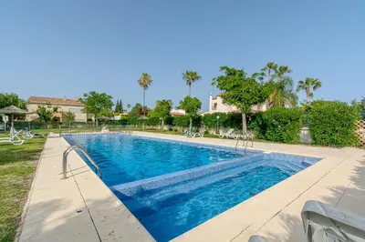 a large swimming pool with blue water at Entre o Vale e o Mar - Vale Parra in Guia